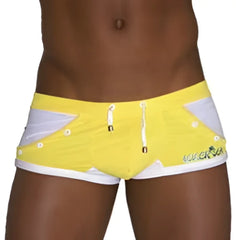 Icker sea eyelets square cut trunk swimwear in bright yellow with white and gray accents and green vicenza logo embroidery
