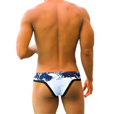Icker sea graffiti macro contrast trim thong swimwear in white and black with a white and navy blue patterned design