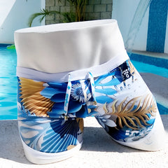Icker Sea Greek floral open side suspender scalloped swim trunks with blue and gold tropical print and white waistband