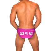 Vibrant pink Icker Sea Kiss My Ass men’s briefs with bold white text and dark contrast stitching bikini underwear fuchsia