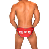 Red jakerise briefs with white kiss my ass text and gray trim featuring contrast stitching bikini underwear design
