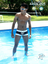 Black and white Icker Sea Legs lace-up front swim trunks with square cut pouch for stylish beachwear