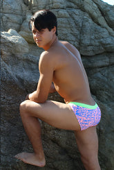 Bright pink and neon green icker sea letters bikini swimwear with bold blue wordplay pattern swim trunks