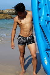 Icker sea letters square cut trunk swimwear in black with white graffiti-style lettering and a drawstring waistband