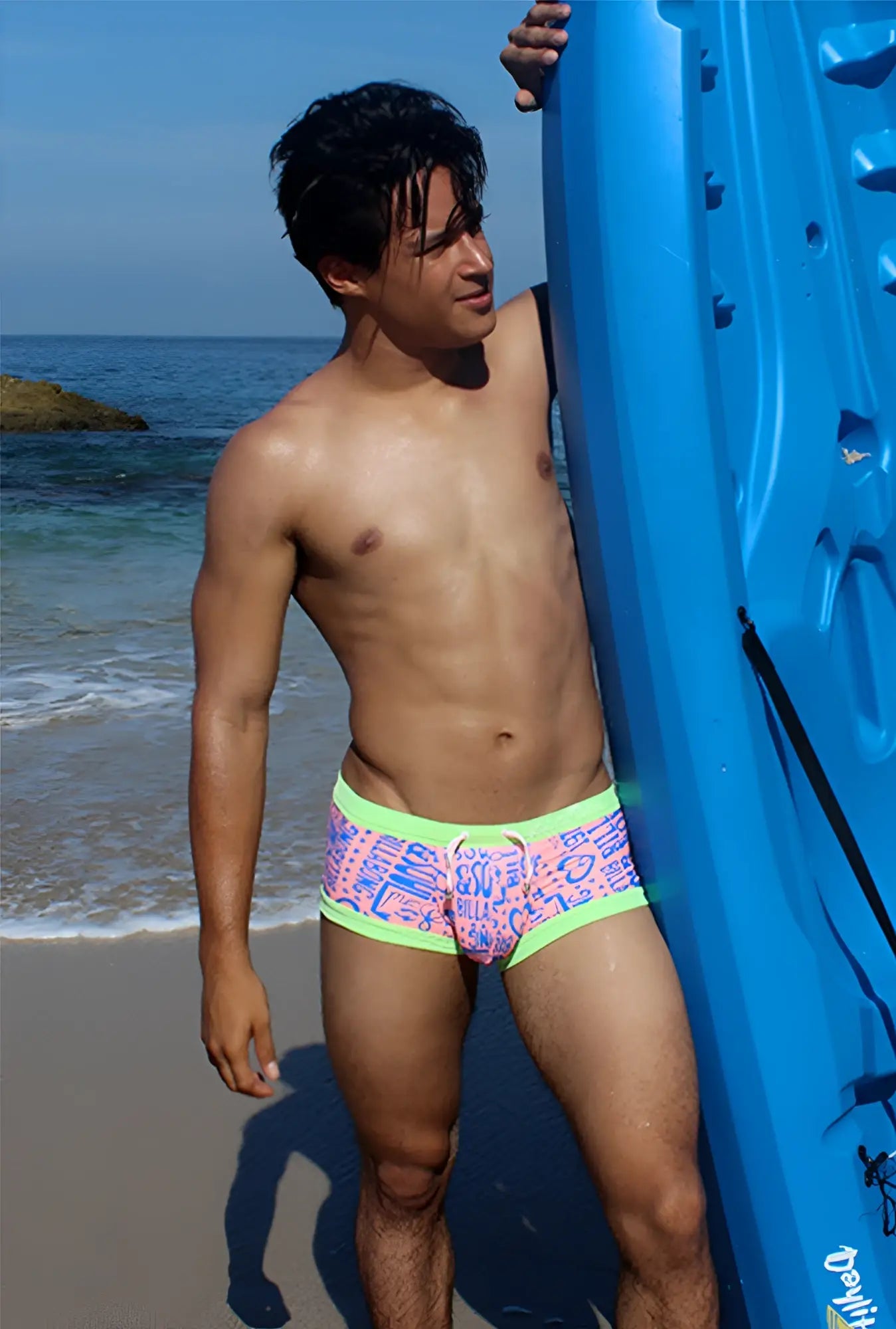 Brightly colored icker sea letters square cut trunk swimwear with pink blue graphic pattern and neon green trim