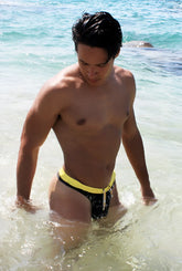 Icker Sea Letters thong swimwear black with bold yellow waistband and white drawstring for swim use