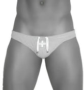 Gray athletic jock brief with white cross emblem and drawstring ties from icker sea lifeguard swimwear collection