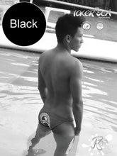 Black icker sea lifeguard micro slip bikini swimwear backside showing white logo on black swim trunks