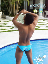 Back view of bright blue icker sea lifeguard micro slip bikini swimwear with white logo on swim trunks
