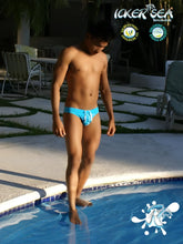 Bright blue icker sea lifeguard stitching tanga thong swimwear with matching drawstring waistband front view