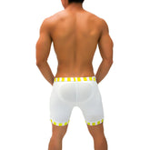 White athletic shorts with yellow and white striped waistband and hem translucent material padded back panel iker sea lines