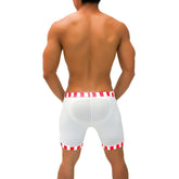 White athletic shorts with red and white striped trim and translucent material from icker sea lines candy stripe trim collection
