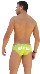 Back view of icker sea lime green swim trunks with white kiss my ass text and logo trim slip bikini underwear