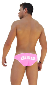 Back side of bright pink Icker Sea logo trim slip bikini underwear featuring white kiss my ass text across the back