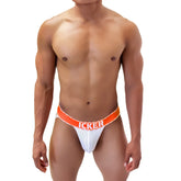 White mesh athletic brief with bold orange waistband featuring icker brand name from icker sea mesh contrast jock strap underwear