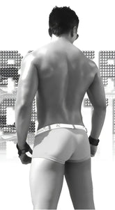 Black and white image of a muscular man wearing icker sea sailor belted logo square cut trunk swimwear in green and white