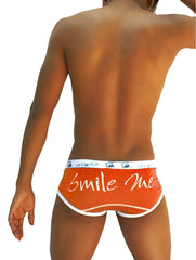 Icker Sea orange briefs with white trim featuring smile me cursive script ideal for comfortable underwear wear
