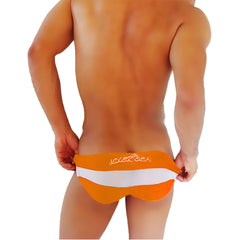 Orange and white striped men’s swim trunks with joker sea embroidered on waistband from icker sea transparent panel slip bikini underwear collection