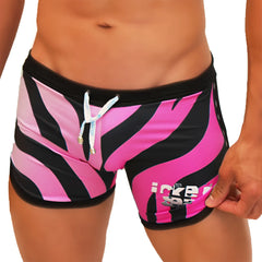 Icker Sea zebra open side suspender scalloped swim shorts in vibrant pink and black zebra stripes with white drawstring and gold-tone aglets