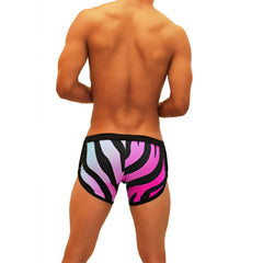 Vibrant pink and black zebra-striped swim trunks with open side suspender and scalloped design by Icker Sea