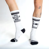 White crew socks with black text reading id fuck me and matching black stripes toe caps and heel accents