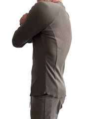 A sleek olive-green ribbed thermal v-neck long sleeve top with tailored fit and subtle side seam detailing