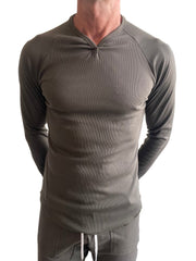 A sleek olive green thermal v neck long sleeve shirt with ribbed fitted design for layering and warmth