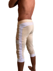 Beige edge cuffed yoga capri pants with white mesh side panels and elastic cuffs for athletic wear