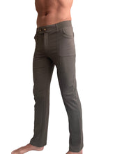 Dark olive green tactical urban cargo pants with multiple pockets and button closure for versatile use