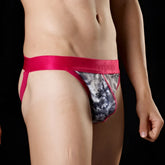A vibrant pink calvin klein brief with black and white floral print in size m designed for comfortable everyday wear