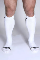 Iron Grip knee high socks in white with black cuff stripes and cellblock 13 branding on the toe