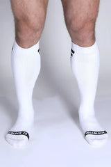 Iron Grip knee high socks in white with black cuff stripes and cellblock 13 branding on the toe