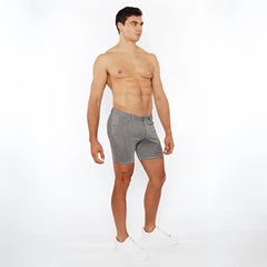 Jaquard stretch knit chino shorts in gray with subtle white polka dots featuring a tailored fit and button closure