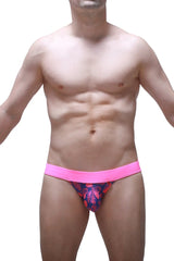 Bright pink and navy blue patterned men’s briefs with bold tropical leaf design from the jockstrap tropical hearts collection