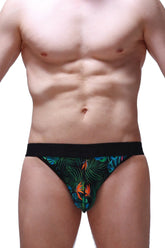 Black jockstring tropical briefs featuring a vibrant tropical leaf and bird pattern in green blue and orange colors