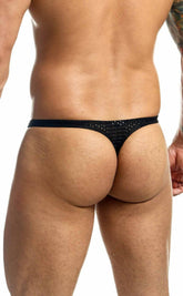 Black joe snyder holes thong with textured sequined pattern on fabric shown from the back side