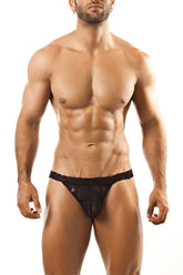 Black lace thong with subtle pattern and small logo on waistband by Joe Snyder in a front view