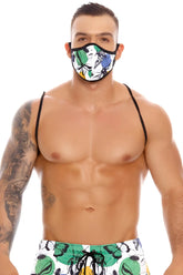 A vibrant tropical leaf and butterfly patterned fabric face mask with black trim jor beetle mask 1321 size one size