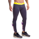 Dark gray jor speed long pants with bright yellow waistband and purple pink white geometric patterns on outer thighs