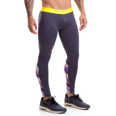 Dark gray jor speed long pants with bright yellow waistband and purple pink white geometric patterns on outer thighs