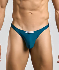 Teal-colored justin and simon classic tanga thong with sleek form-fitting design shown from the back side