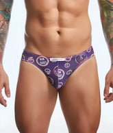 Justin + Simon classic mens bikini briefs in purple with pride day love and win text and rainbow design pattern