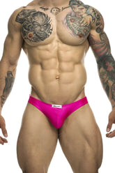 Bright pink justin simon xsj01 classic bikini briefs with white brand label designed for athletic wear