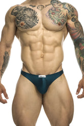Dark teal justin simon xsj03 classic athletic briefs with white brand tag at waistband in opal green color