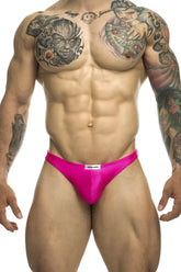 Bright pink satin briefs with a white brand tag at the waistband from JUSTIN+SIMON XSJ03 classic thongs collection