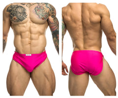 Vibrant hot pink justin simon xsj09 running shorts with a small white brand tag on the waistband
