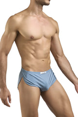 Light blue form-fitting men’s briefs with subtle side slit and white label at waistband matching justin simon xsj09 metal green running shorts