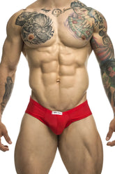 Red athletic cheek briefs by justin simon with a white waistband label designed for active wear