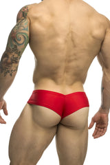 Red form-fitting swim trunks from JUSTIN SIMON XSJ22 cheek briefs with smooth glossy fabric front view