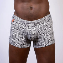 Kaleidoscope sq cut trunk boxer briefs with black and white geometric pattern and subtle orange logo waistband
